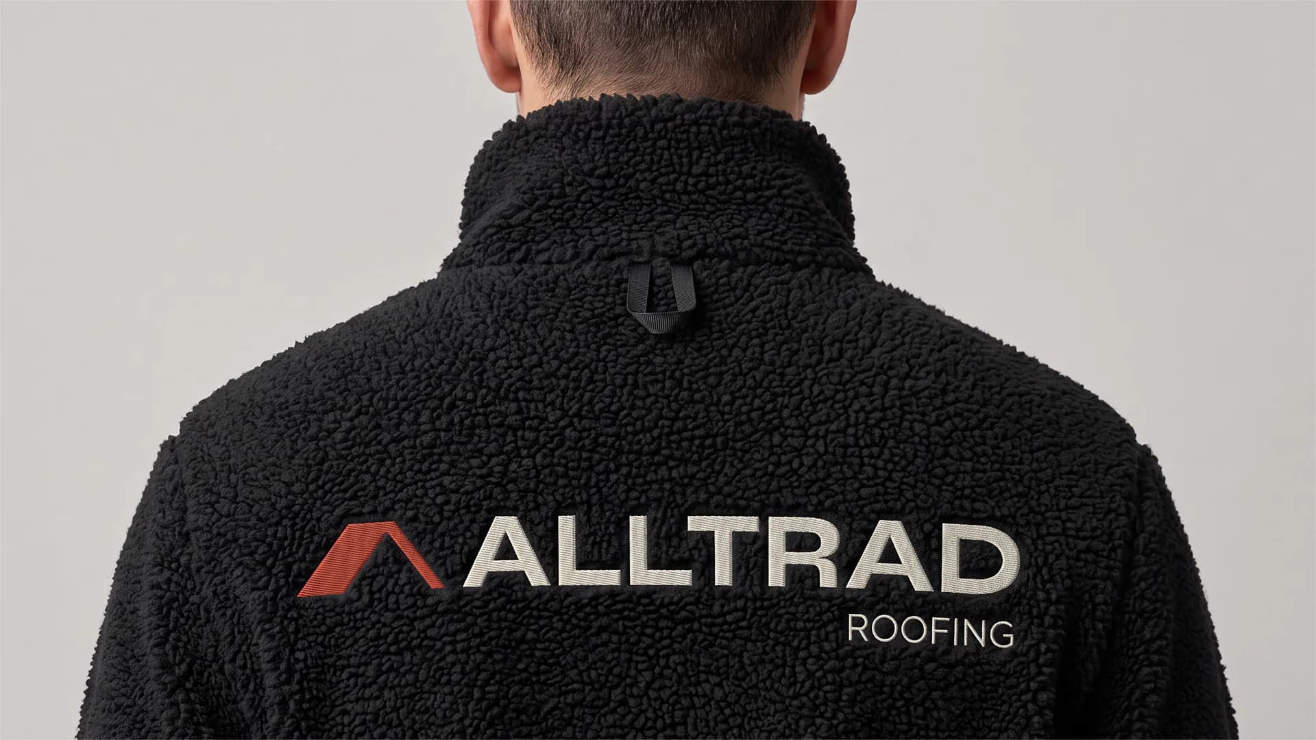 Alltrad Roofing logo embroidered on a branded fleece jacket