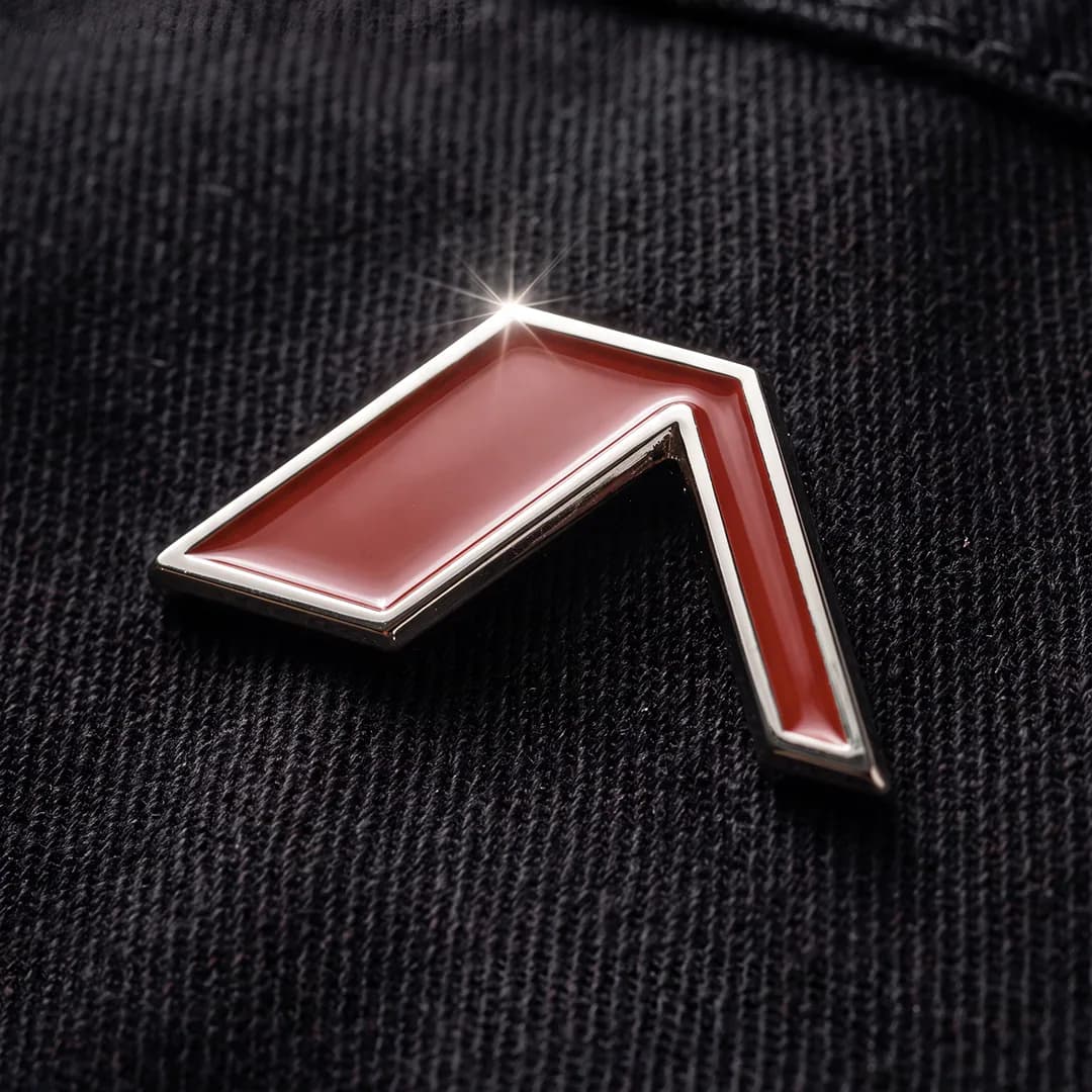 Alltrad Roofing enamel pin badge of the red chevron mark