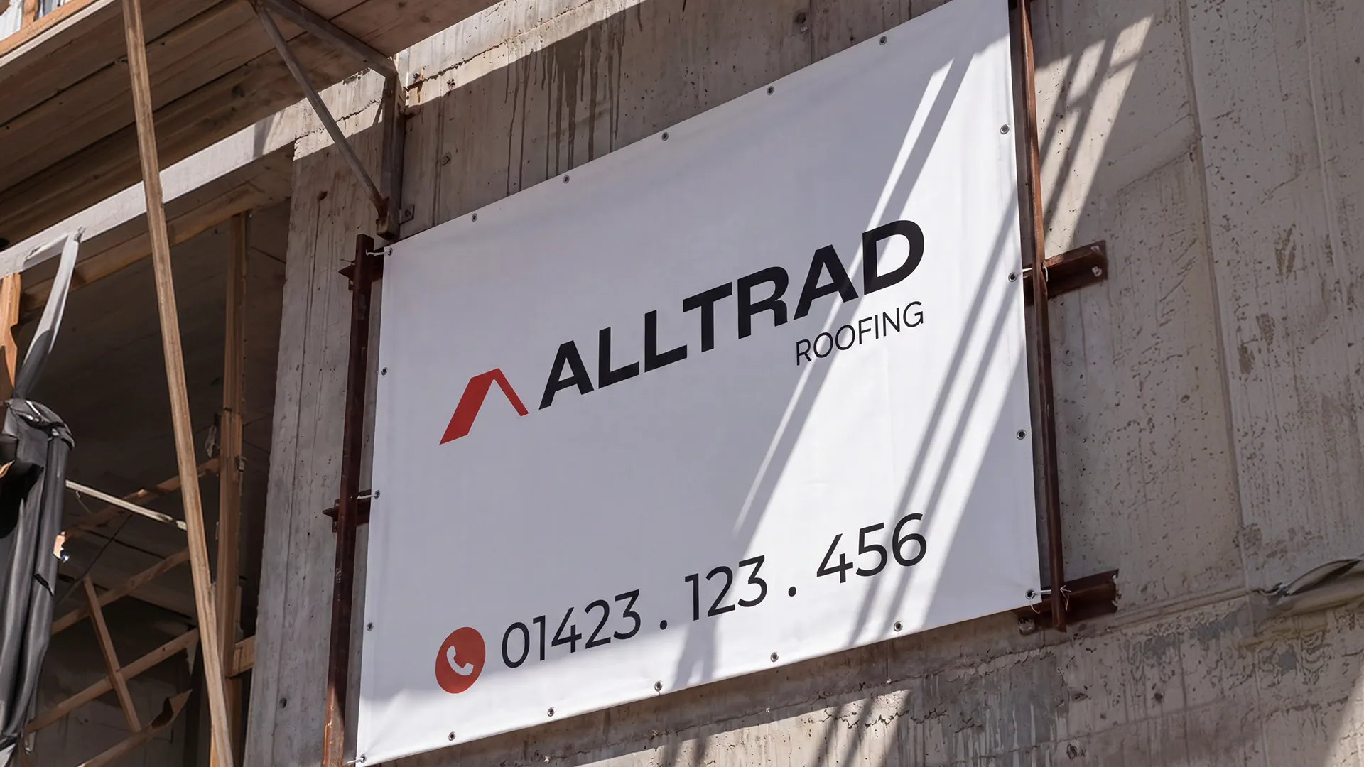 Alltrad Roofing banner on construction site scaffolding
