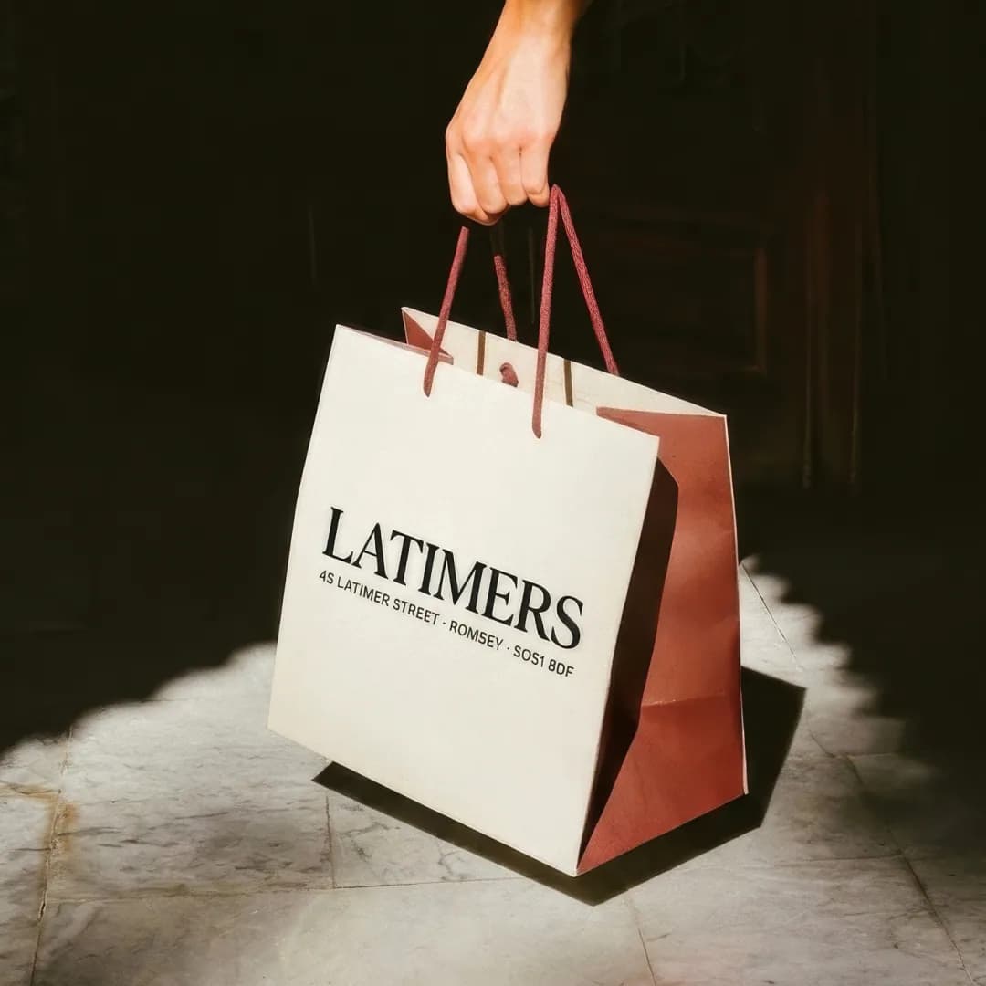 Latimers takeaway paper bag with red handles