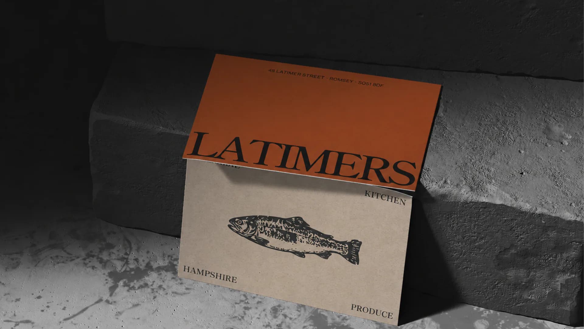 Latimers branded packaging box on a stone surface