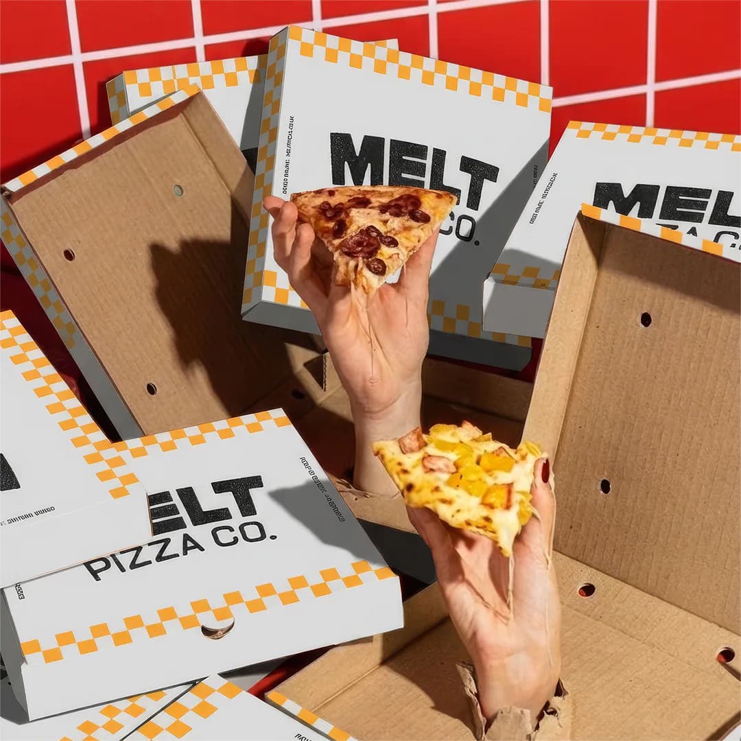 Melt Pizza Co branded pizza boxes with hands reaching for slices