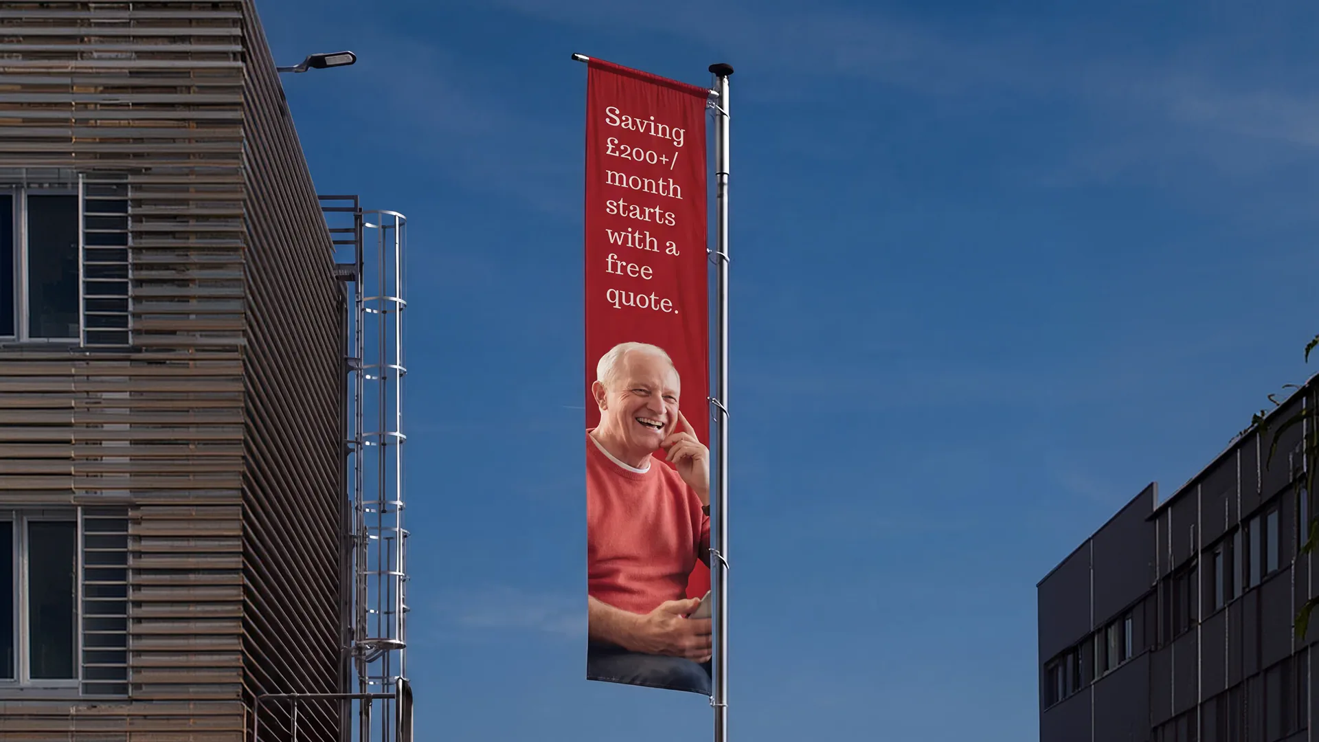 Remigo vertical banner hanging between city buildings