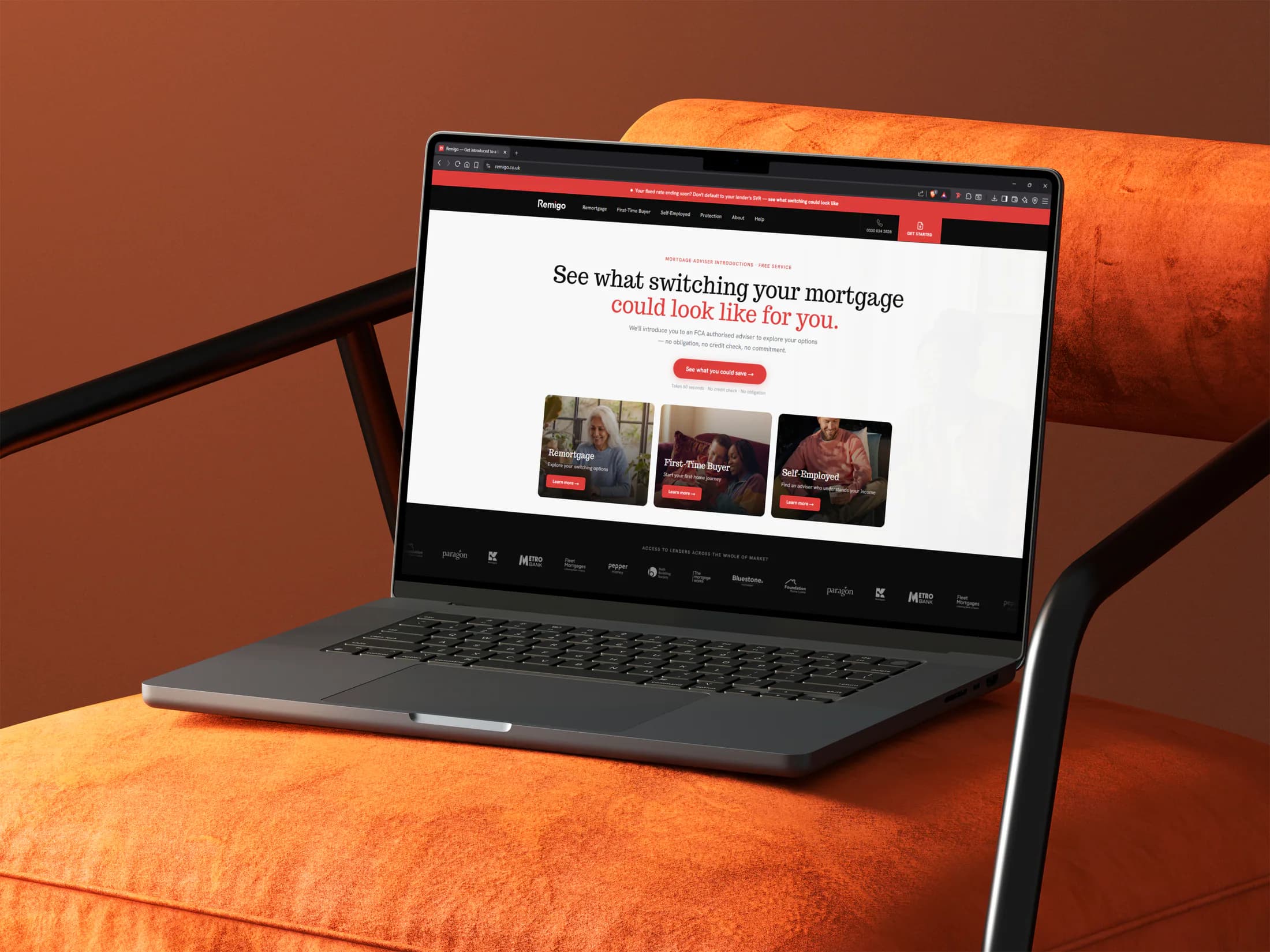 Remigo website shown on a laptop resting on an orange armchair