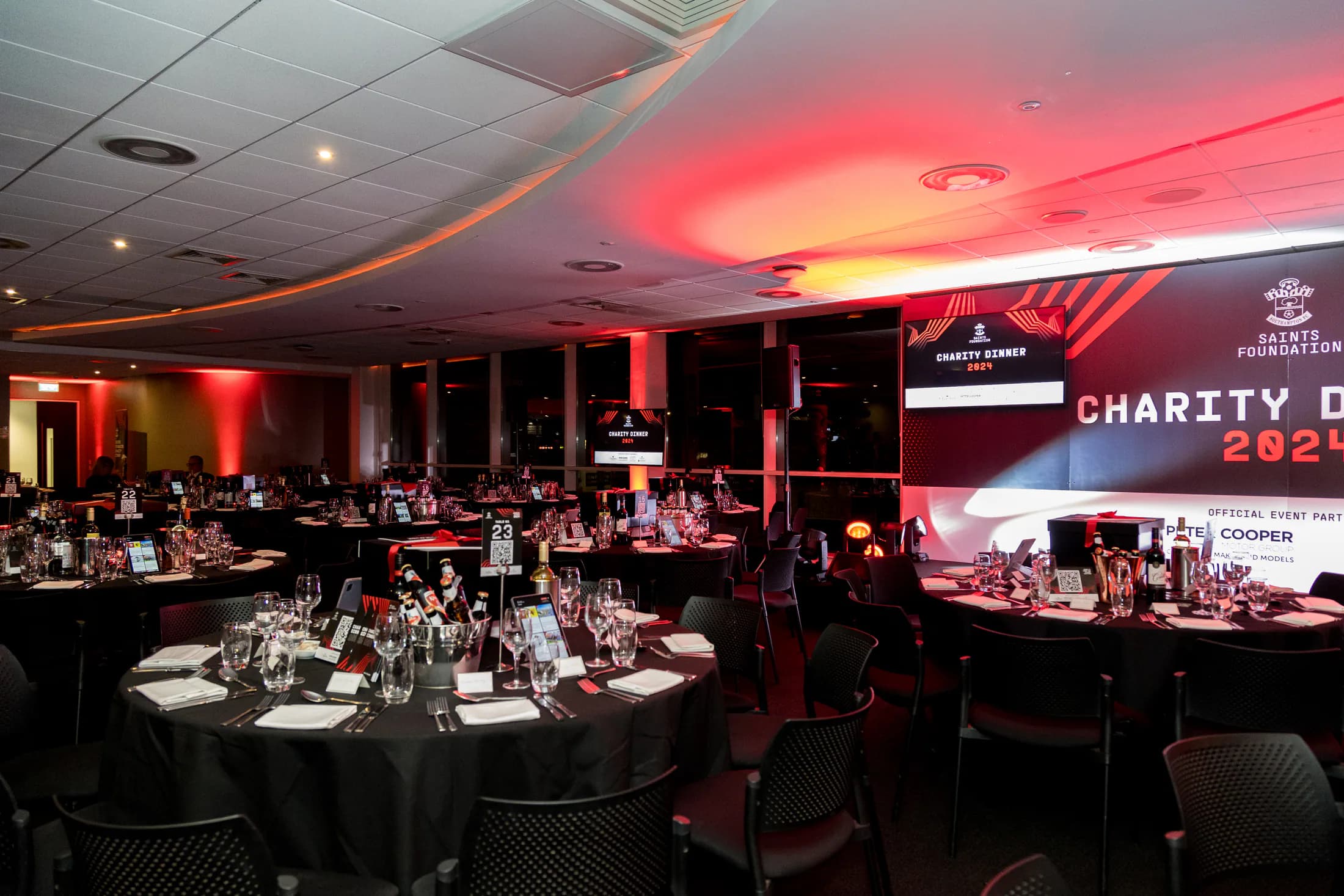 The Saints Foundation Charity Dinner room at St Mary's dressed in the event branding
