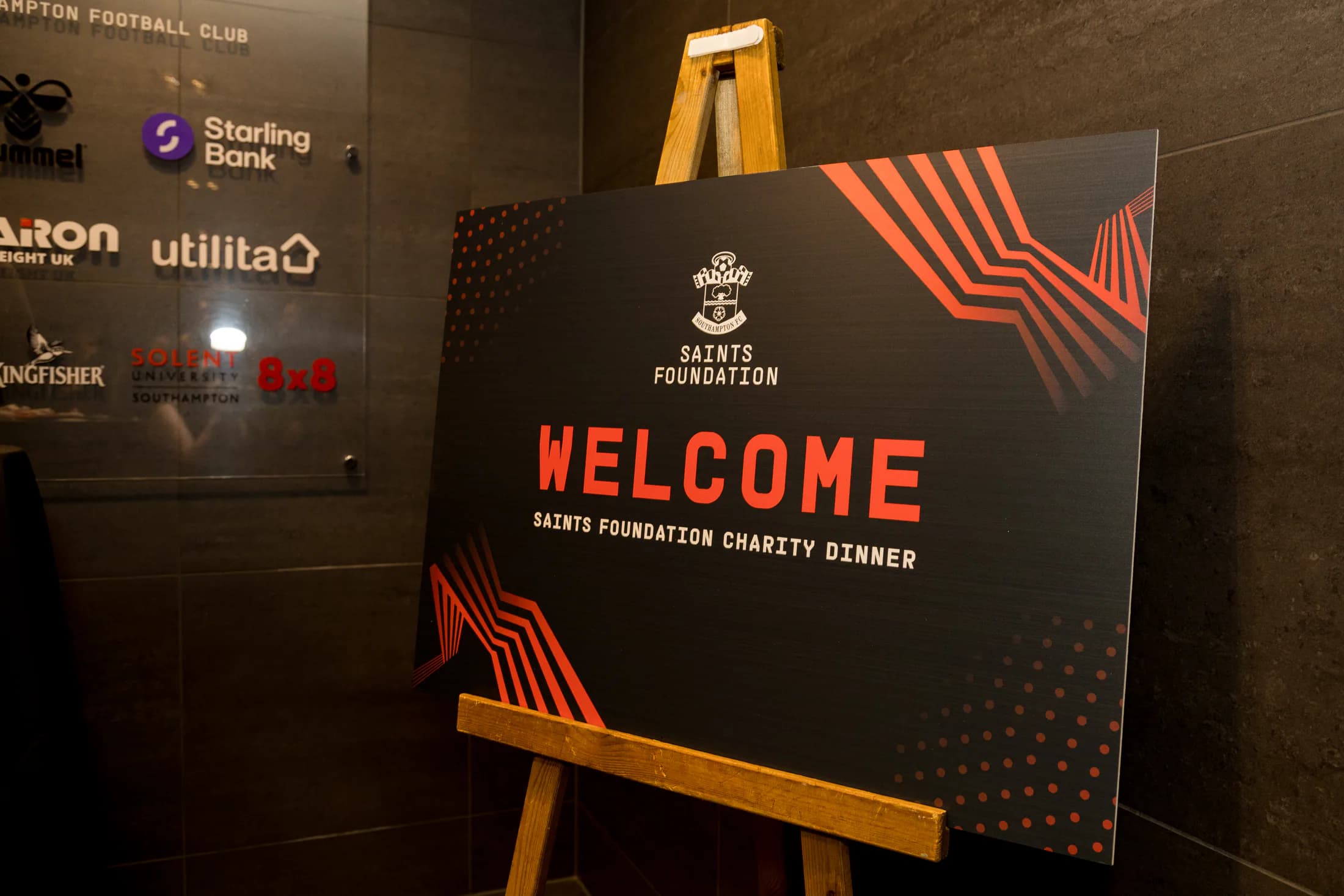 Saints Foundation Charity Dinner welcome board on an easel at the venue entrance