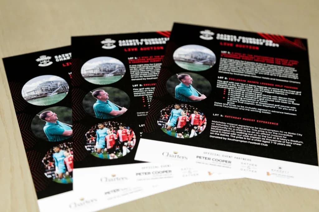 Saints Foundation live auction flyers listing prize lots for the charity dinner